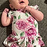 Bonnie joined the competition — help win amazing prizes! baby, infant, child, floral_dress, pink_roses, green_leaves, lying_down, gray_background, curious_expression, cute, skin, person, portrait, indoors, soft_lighting, short_hair, small_hands, open_mouth, casual, comfortable