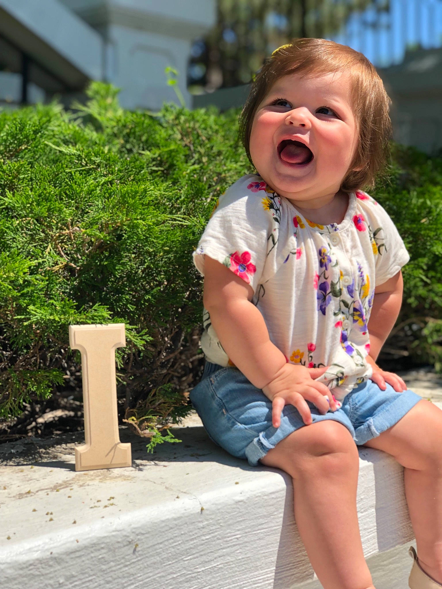 Ayvah is registered to the contest to win money with this photo: child, daughter, facial_expression, fun, grass, happy, laugh, leg, leisure, person, photography, sitting, smile, summer, toddler, vacation
