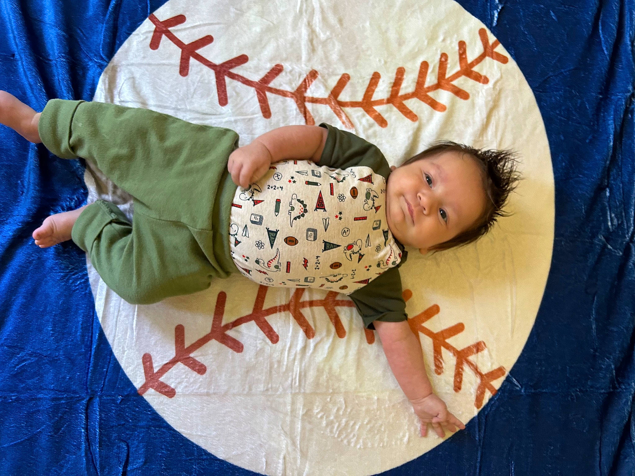 Ezekiel is registered to the contest to win money with this photo: baby, baby_products, baby_toddler_clothing, child, circle, comfort, elbow, facial_expression, font, fun, happy, head, linens, pattern, person, room, sleeve, smile, t_shirt, toddler