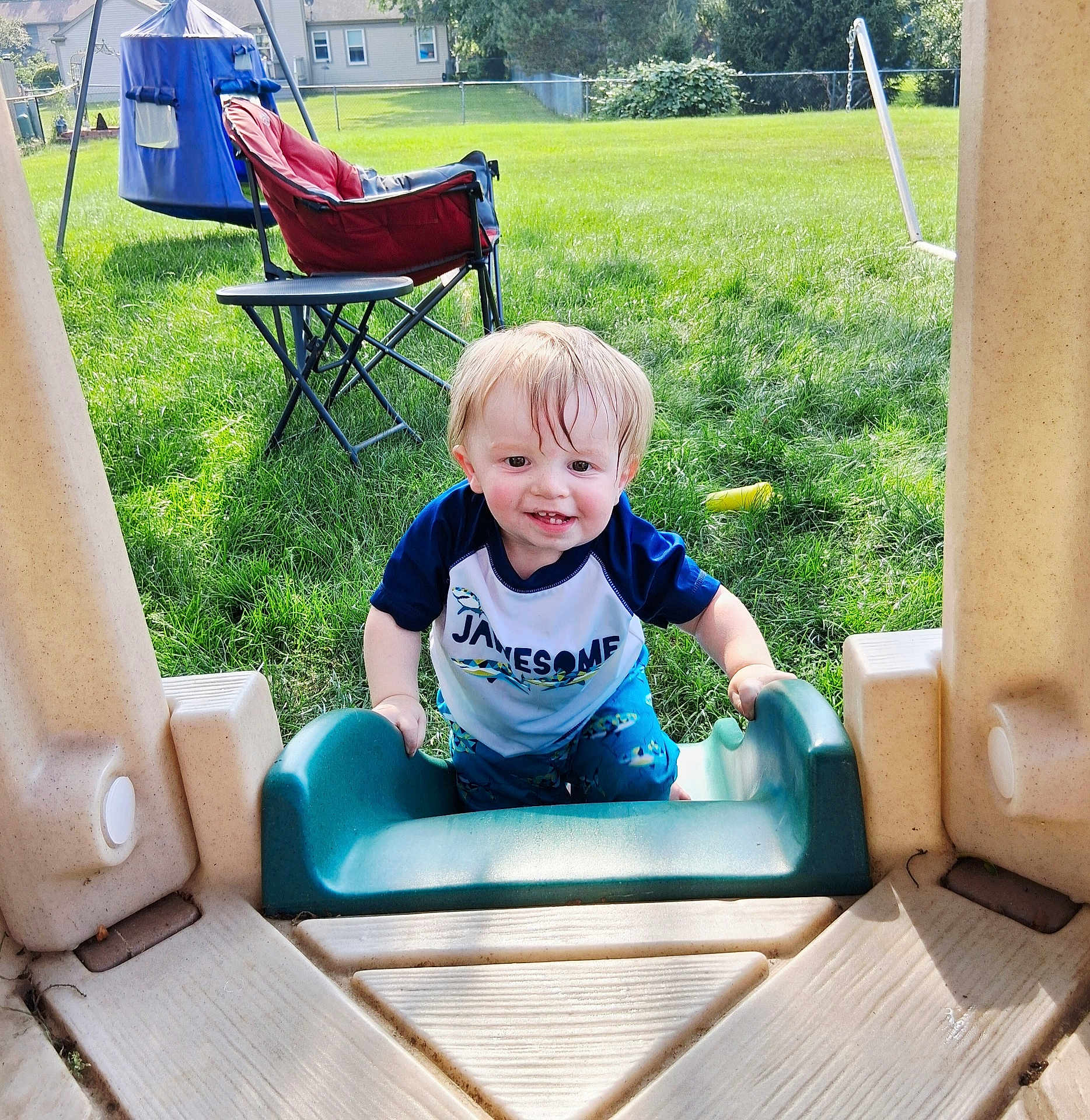 Asher joined the competition — help win amazing prizes! toddler, child, smiling, outdoor, grass, playground, slide, plastic, chair, backyard, sunlight, clothing, person, happy, toy, tent, nature, daylight, fun, play