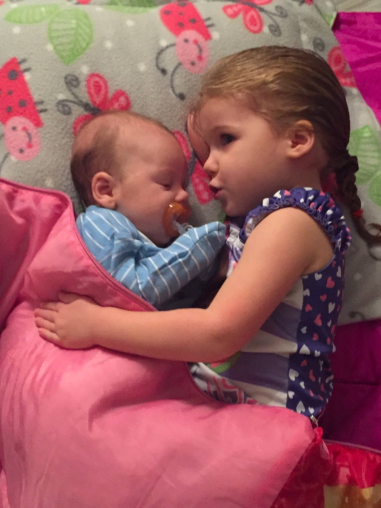 Klair is registered to the contest to win money with this photo: child, daughter, fun, gesture, happy, hug, interaction, mother, person, pink, toddler