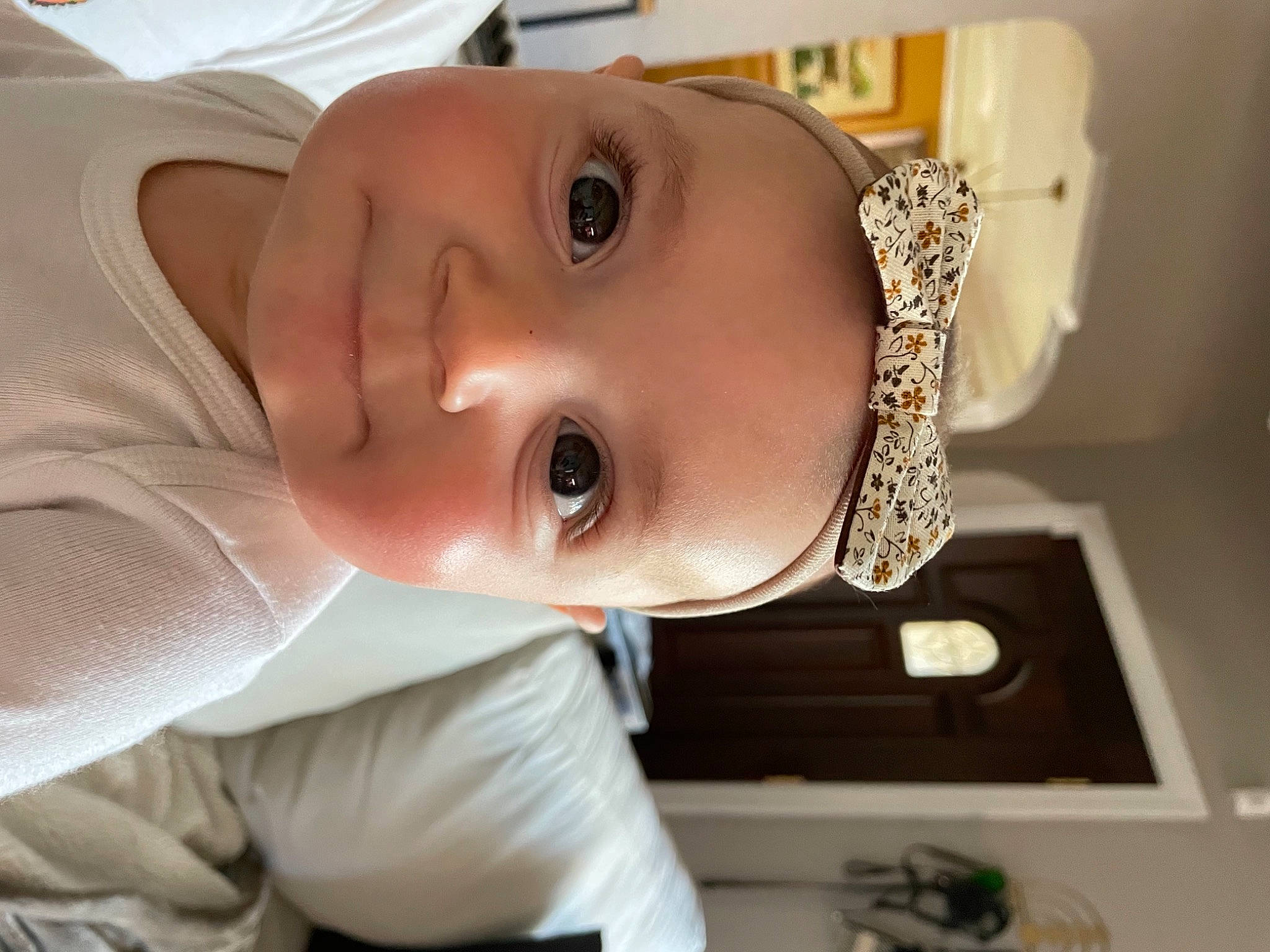 Astrid is registered to the contest to win money with this photo: baby, baby_toddler_clothing, cheek, child, cool, eye, eyebrow, eyelash, forehead, iris, jaw, lip, person, portrait_photography, skin, sleeve, toddler, white