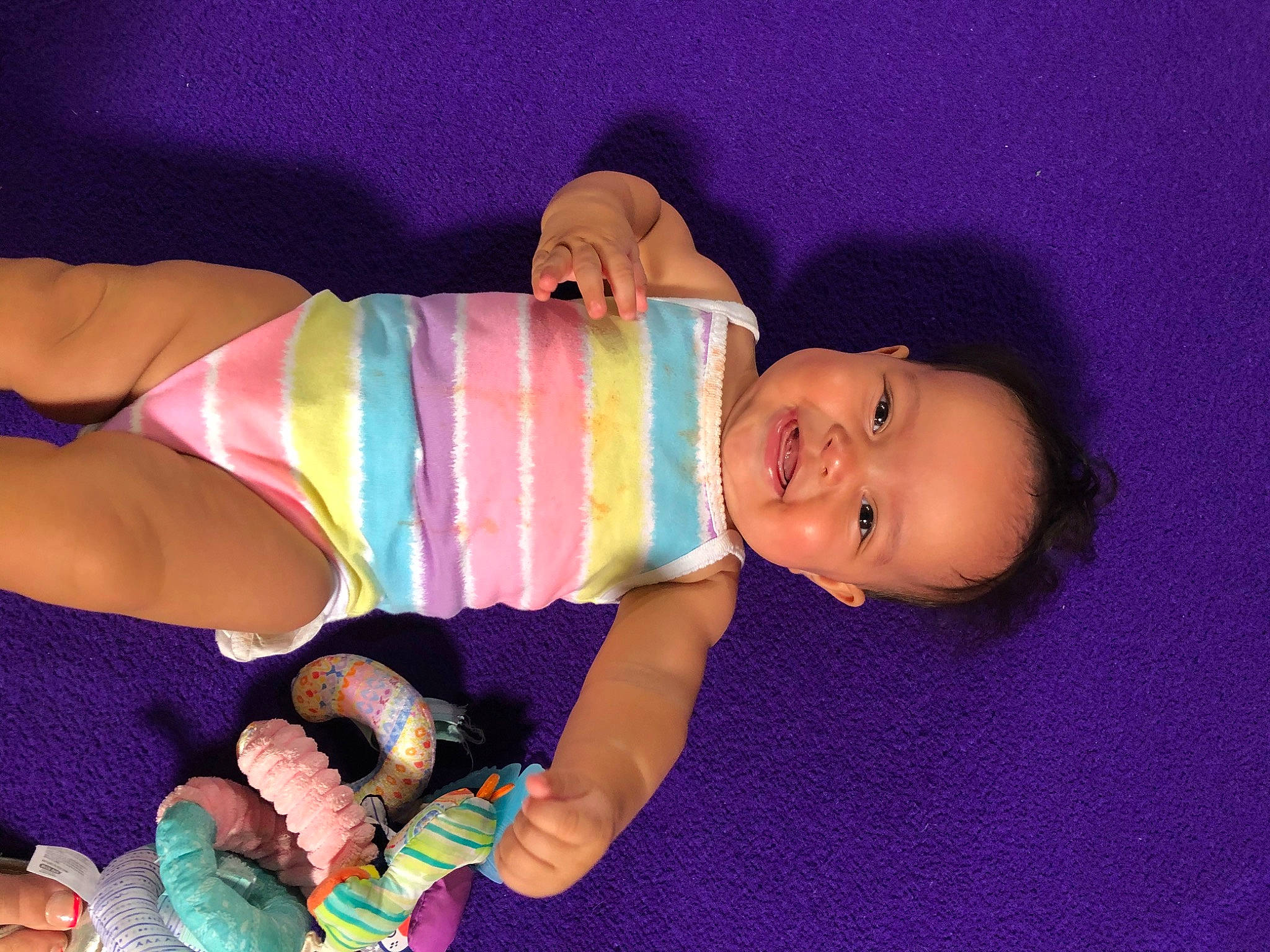 Lila is registered to the contest to win money with this photo: abdomen, baby, baby_toddler_clothing, child, finger, fun, happy, hat, human_body, joy, mouth, muscle, nail, person, pink, skin, smile, textile, thigh, toddler