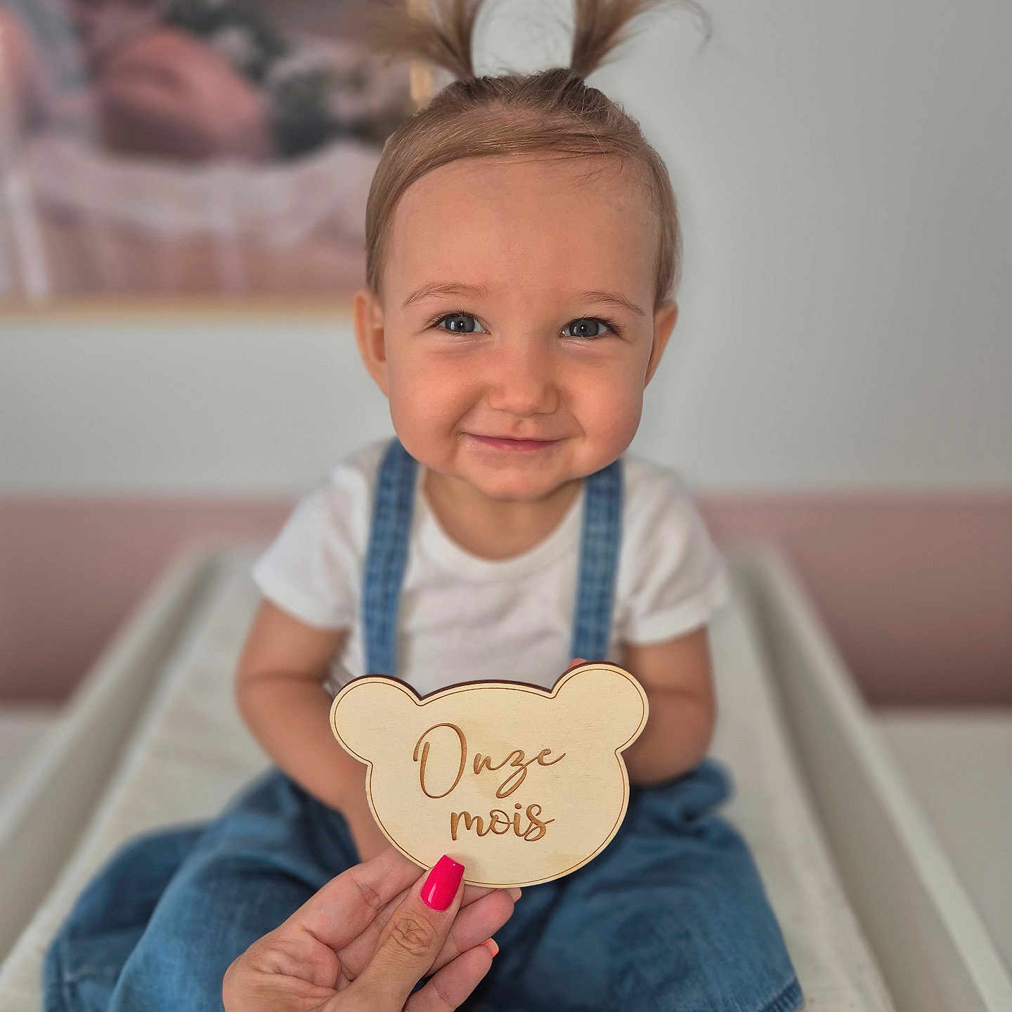 Avaluna participe au concours pour gagner de l'argent avec cette photo : baby, child, girl, smile, pigtails, blue_dress, white_shirt, hand, pink_nail_polish, wooden_sign, milestone, changing_table, portrait, indoor, cute, happy, face, person, skin, hair