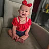 Abriella joined the competition — help win amazing prizes! armchair, baby, child, cute, denim_shorts, face, furniture, happy, headwear, indoor, infant, jewelry, necklace, person, portrait, red_bow, red_top, sitting, skin, smiling