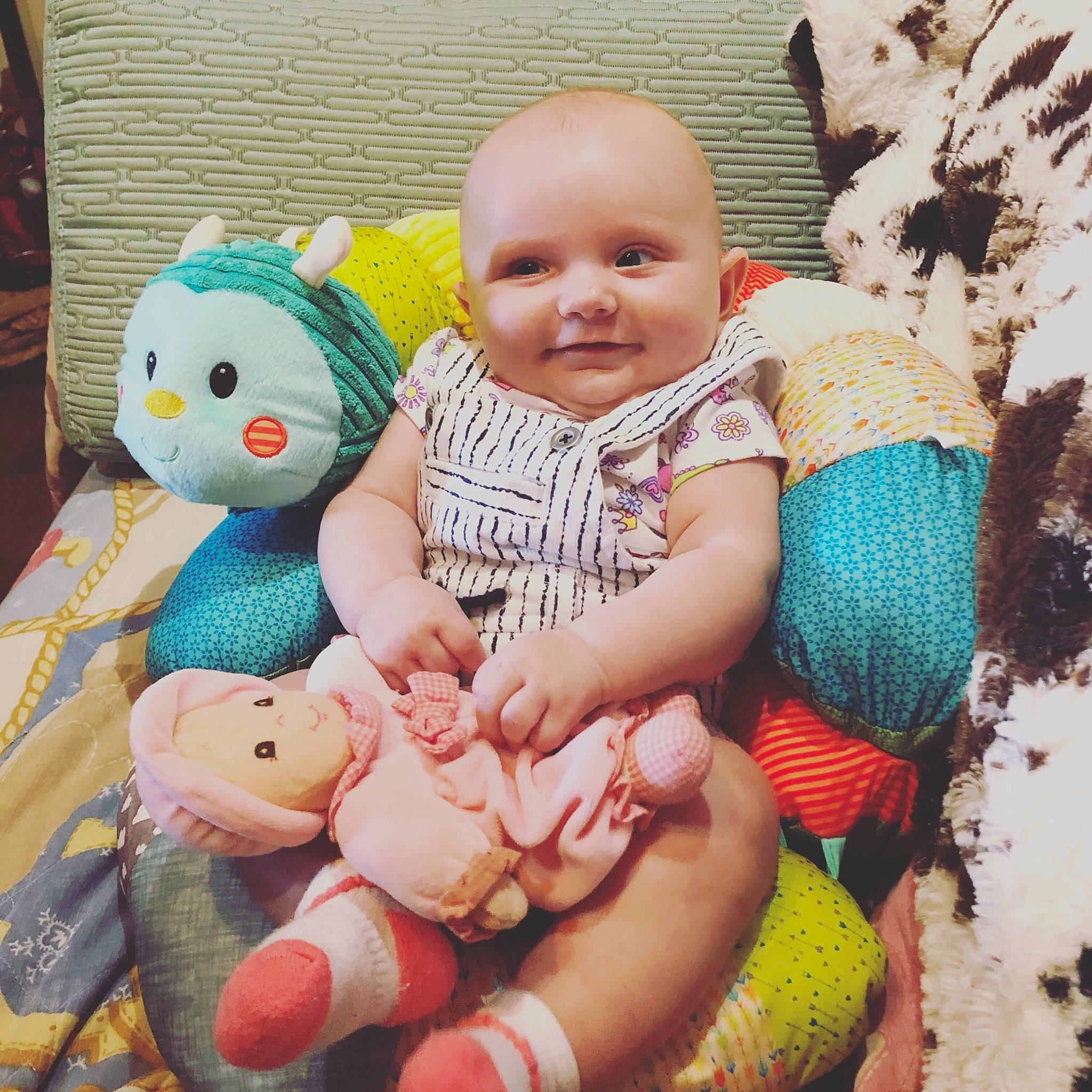 Karisma is registered to the contest to win money with this photo: baby, cheek, child, family, hand, happy, joy, people, person, play, product, sibling, skin, smile, stuffed_toy, textile, toddler