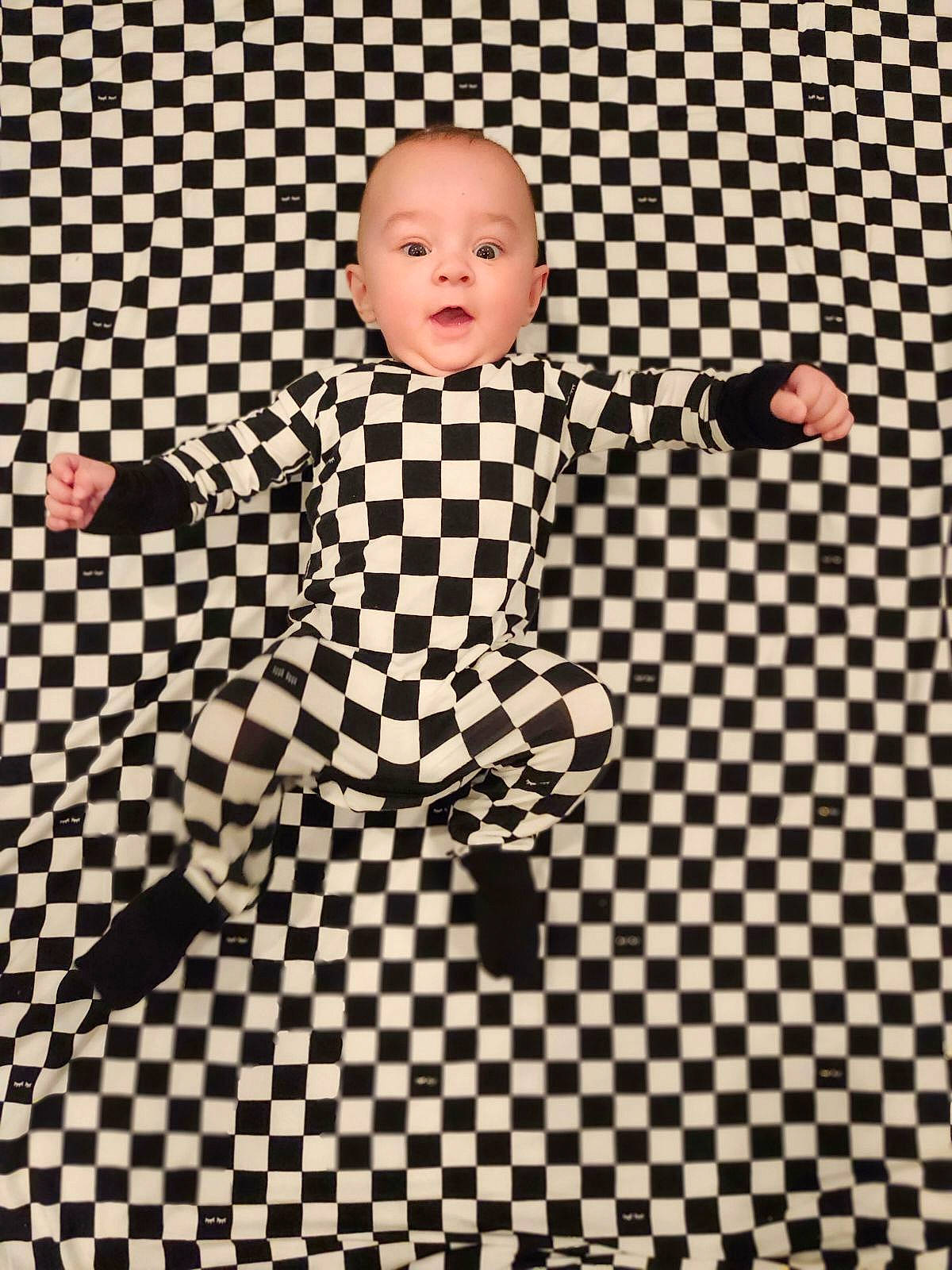 Luciano is registered to the contest to win money with this photo: accessories, bodypart, chess, clothing, coat, face, finger, formalwear, game, hand, happy, head, homedecor, pants, person, photography, portrait, shirt, sitting, tie