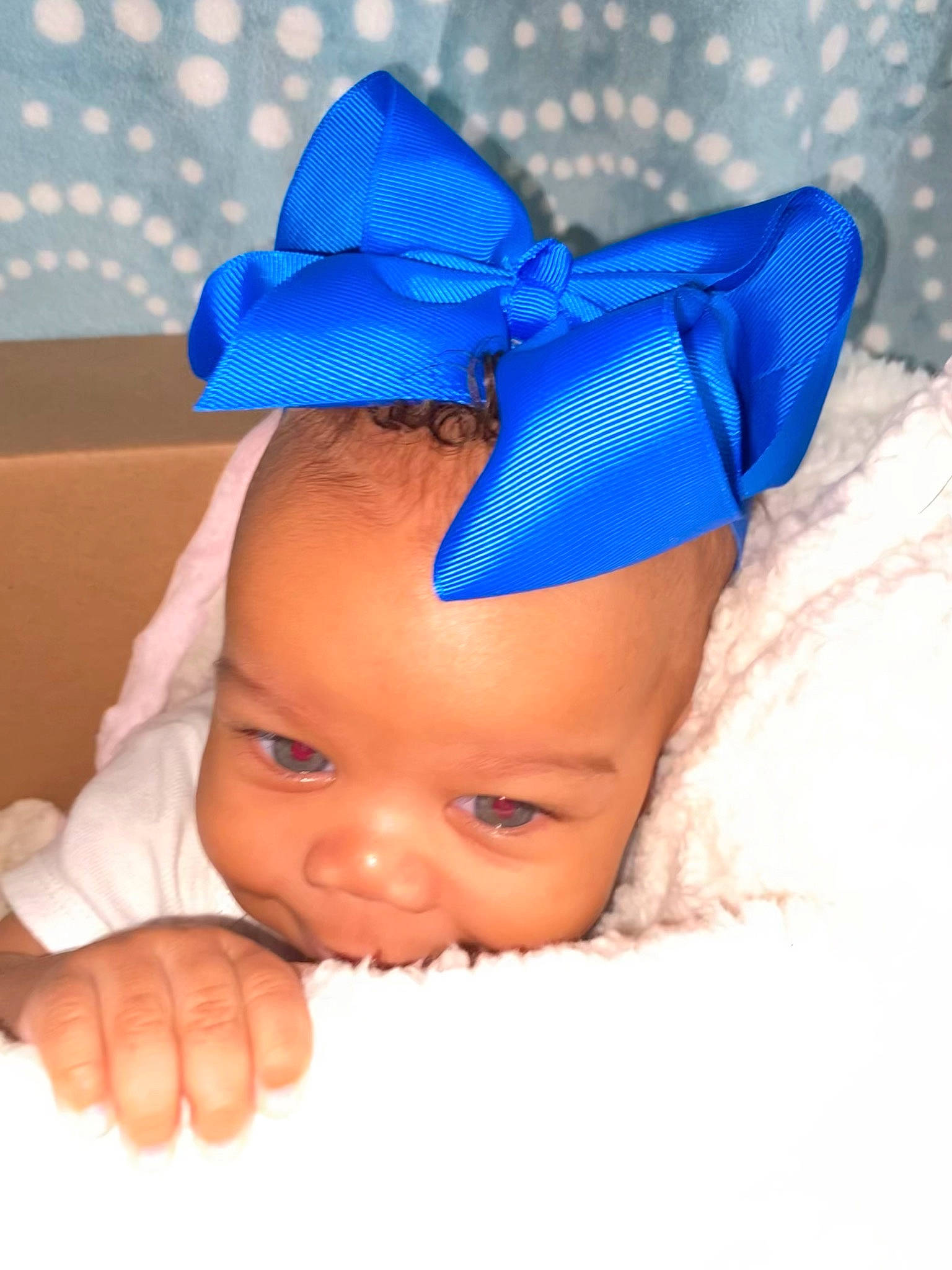 Avayah is registered to the contest to win money with this photo: arm, baby, baby_sleeping, baby_toddler_clothing, cap, costume_hat, eye, face, finger, gesture, hand, happy, head, headband, headgear, headpiece, person, skin, smile, thumb