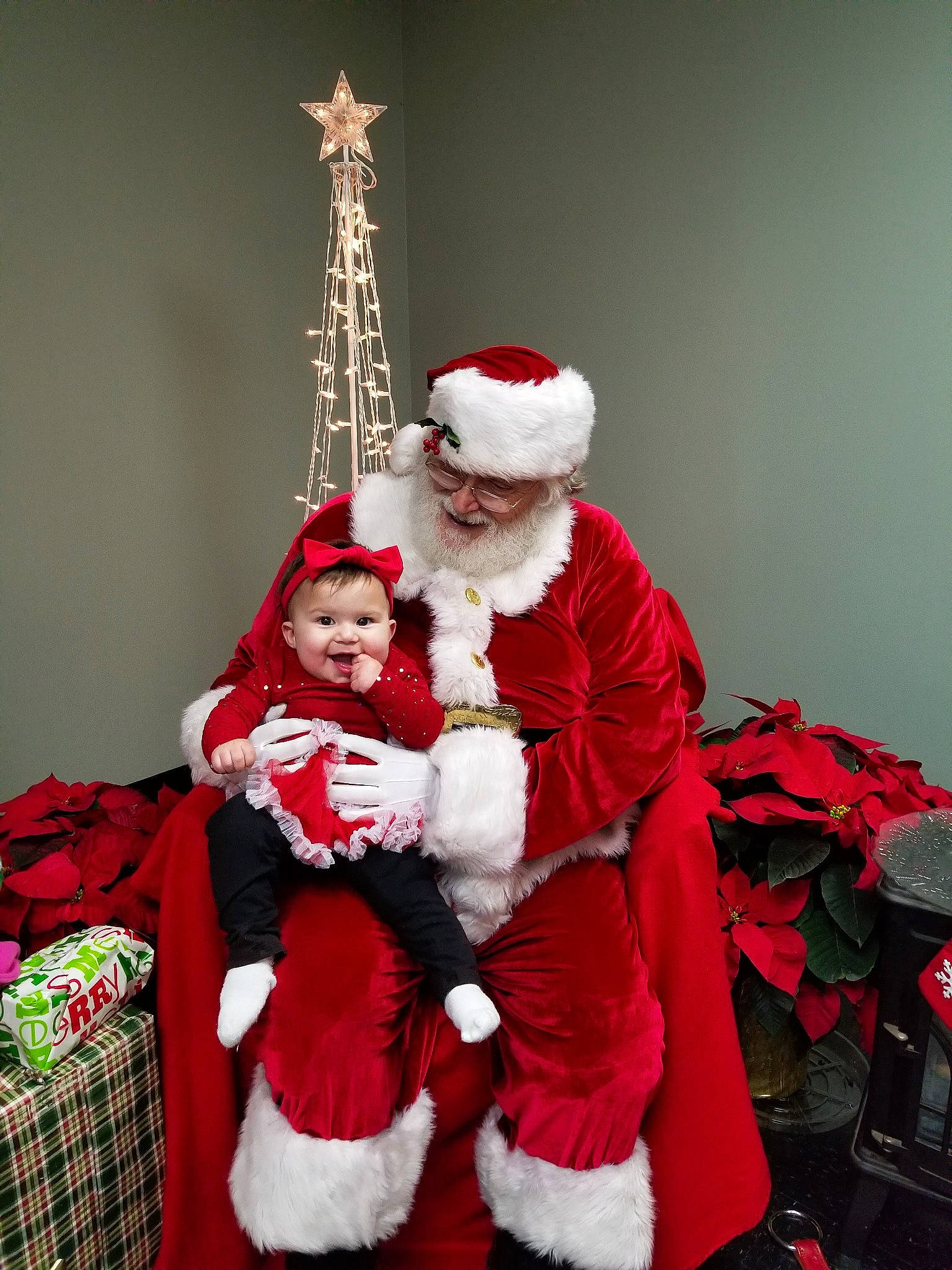 Akira is registered to the contest to win money with this photo: christmas, christmas_eve, christmas_ornament, costume, event, fictional_character, fur, holiday, joy, person, red, santa_claus, tradition