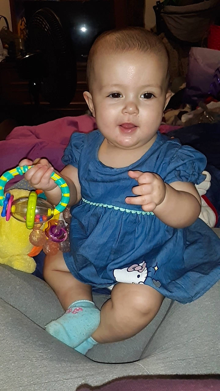 Amya is registered to the contest to win money with this photo: baby, baby_toddler_clothing, cheek, child, iris, person, play, sitting, skin, smile, toddler