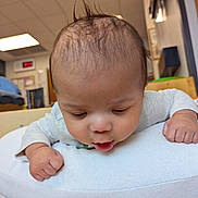 Ezair joined the competition — help win amazing prizes! baby, infant, child, cushion, indoor, curious, soft, hair, face, hands, clothing, tummy_time, pillow, playroom, expression, young, cute, resting, head, skin