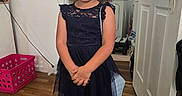 Delilah joined the competition — help win amazing prizes! basket, child, closet, doorway, dress, fashion, formalwear, girl, hair_bow, home, indoors, lace, laundry_room, navy_dress, portrait, purse, sandals, smiling, standing, wood_floor