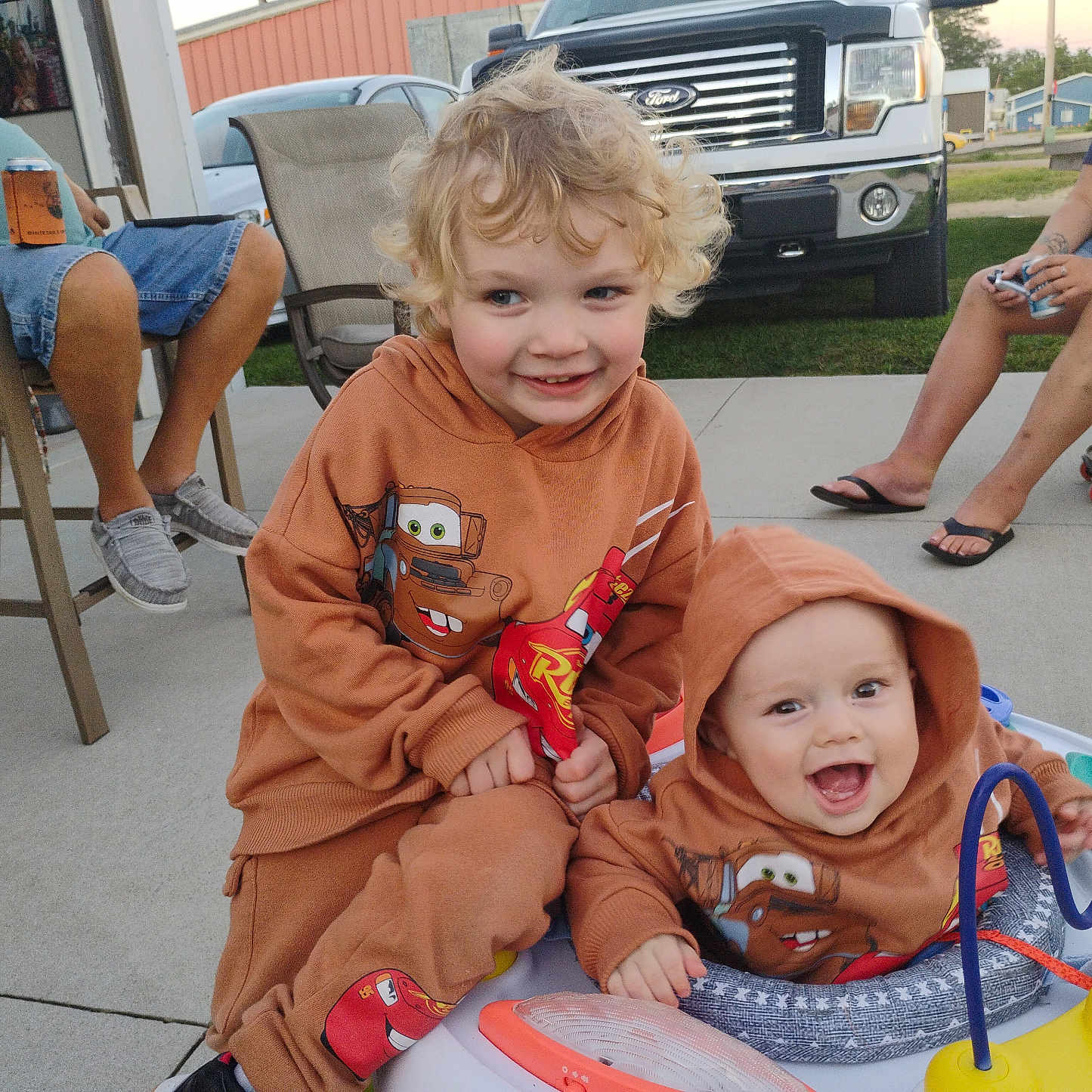 Ragnar And Levi is registered to the contest to win money with this photo: adult, baby, boy, car, chair, child, clothing, face, footwear, furniture, head, male, man, person, photography, portrait, shoe, shorts, transportation, vehicle