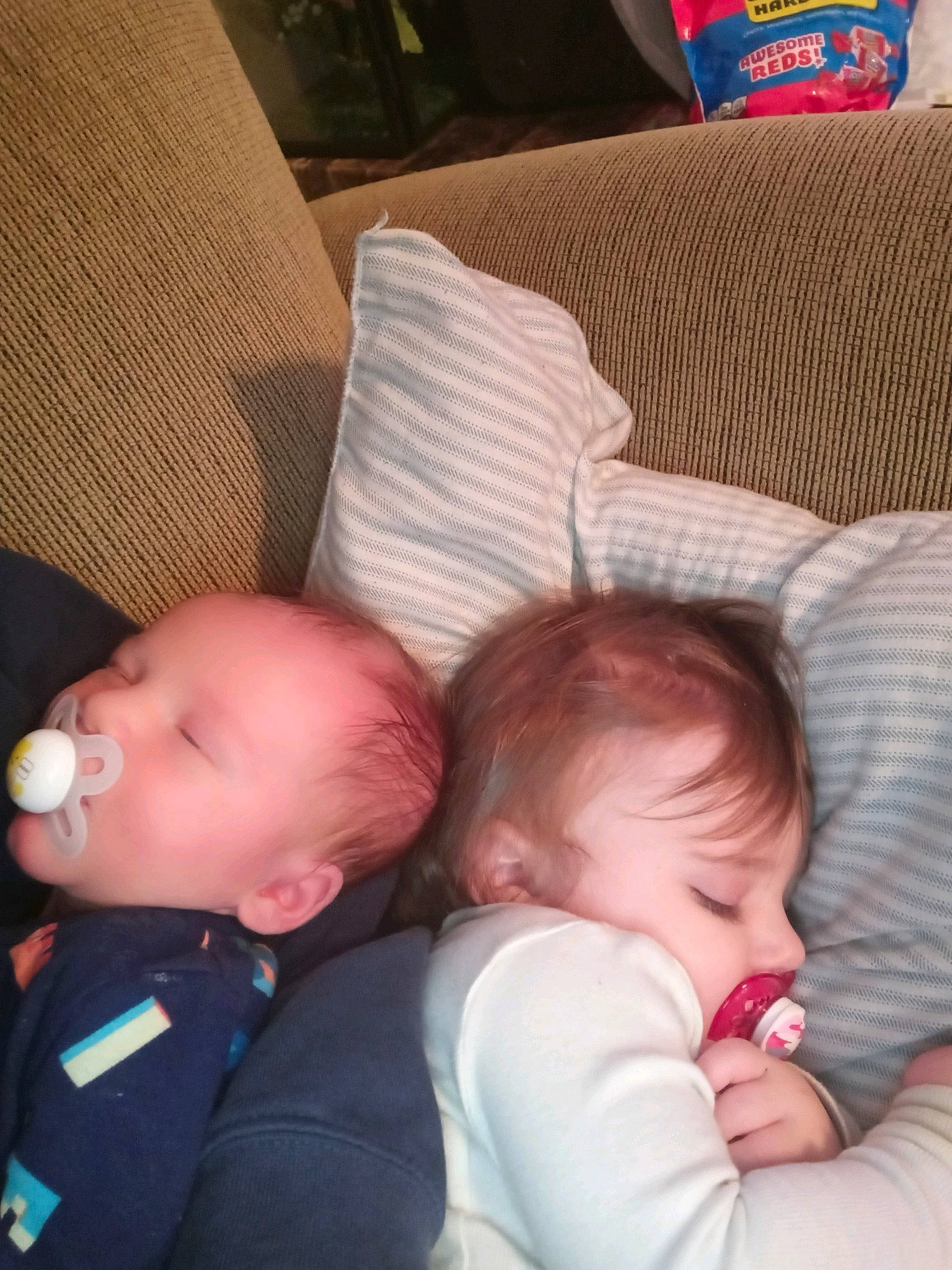 Terrence is registered to the contest to win money with this photo: arm, baby, cheek, comfort, face, facial_expression, finger, hair, hairstyle, hand, head, interaction, lap, mammal, mouth, nose, organ, person, product, skin