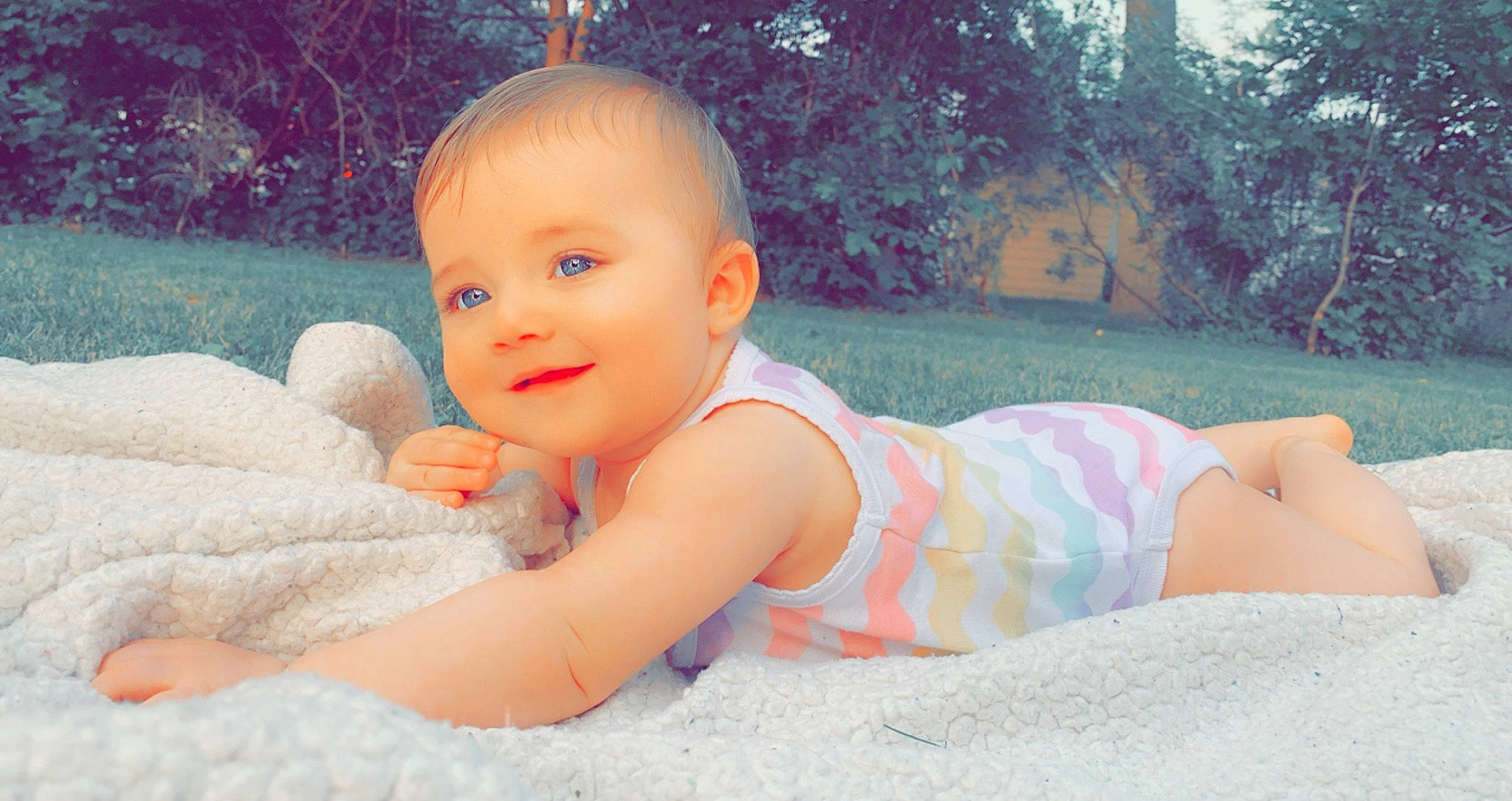 Temperence is registered to the contest to win money with this photo: baby, baby_toddler_clothing, cheek, eye, finger, grass, happy, head, human_body, iris, joy, leg, leisure, mouth, people_in_nature, person, pink, plant, skin, smile