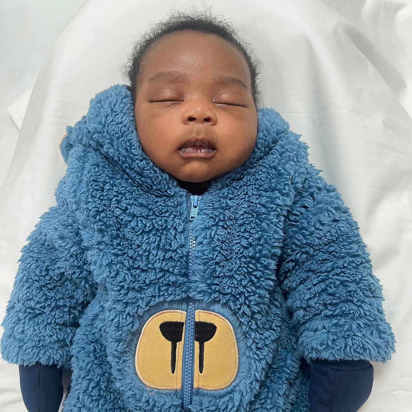 Star joined the competition — help win amazing prizes! baby, babylaughing, blanket, clothing, coat, face, happy, head, hood, hoodie, jacket, knitwear, person, photography, portrait, sleeve, smile, sweater, sweatshirt, yawning