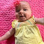 Marti joined the competition — help win amazing prizes! baby, infant, smiling, yellow_dress, headband, flower, pink_blanket, quilted_blanket, lying_down, happy, cute, child, portrait, indoor, fabric, pattern, colorful, closeup, person, apparel