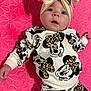 Marti is registered to the contest to win money with this photo: baby, infant, child, headband, bow, clothing, mickey_mouse, pattern, pink, blanket, quilted, floral_pattern, cute, portrait, laying, hand, face, eyes, expression, indoors