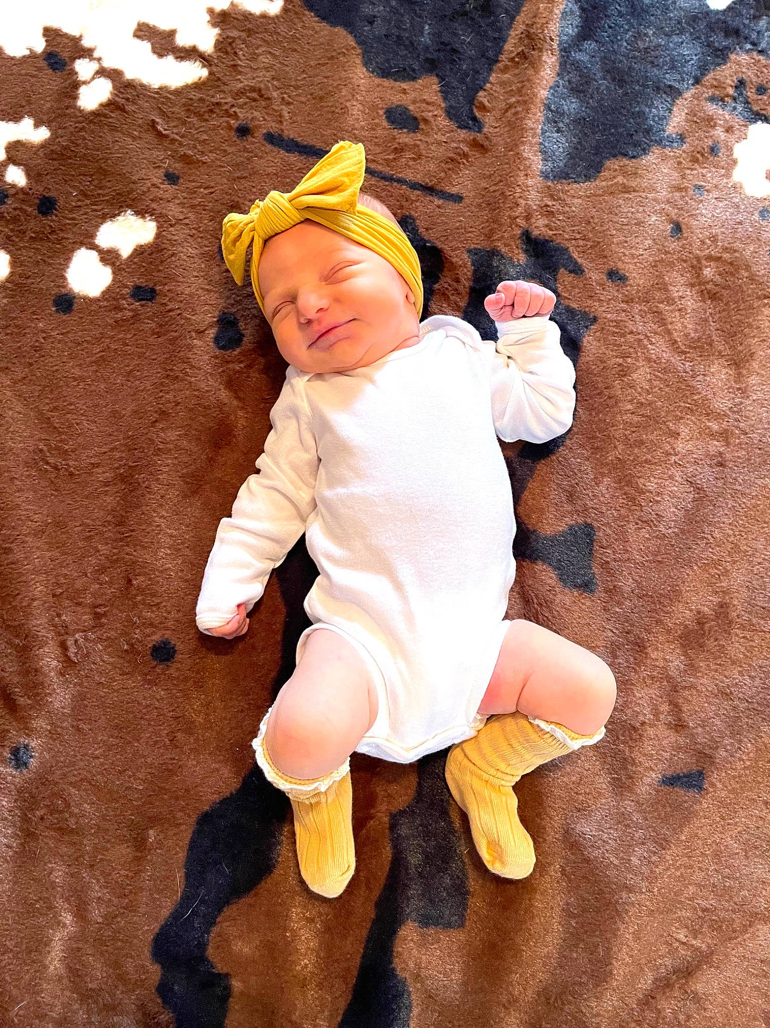 Raylynn is registered to the contest to win money with this photo: art, baby, baby_toddler_clothing, child, fictional_character, foot, fun, gesture, happy, hat, headwear, human_body, human_leg, people_in_nature, person, play, recreation, sleeve, sock, thumb