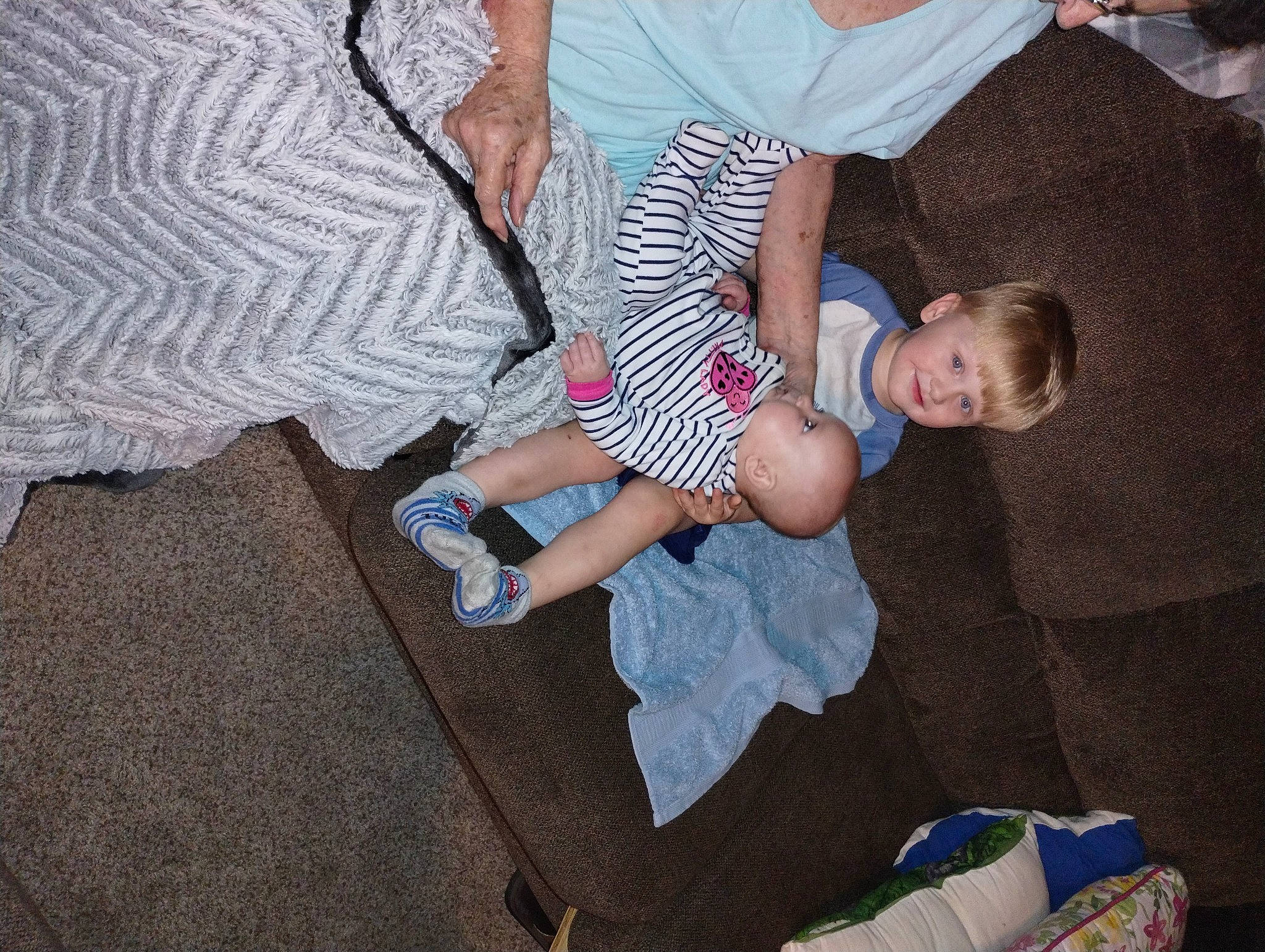 Landon is registered to the contest to win money with this photo: baby, baby_toddler_clothing, child, comfort, event, foot, fun, gesture, happy, human_leg, joy, lap, leg, leisure, person, room, shorts, sitting, sock, t_shirt