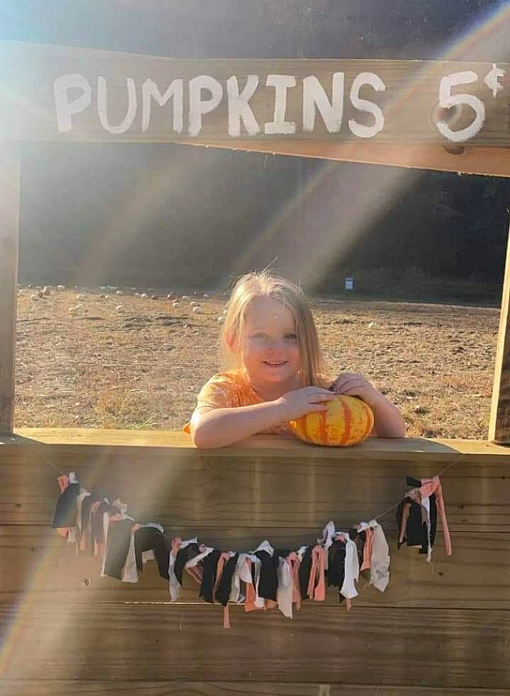 Maci is registered to the contest to win money with this photo: advertising, child, cloud, flash_photography, font, fun, happy, heat, joy, landscape, leisure, morning, person, photo_caption, product, recreation, room, sitting, sky, smile