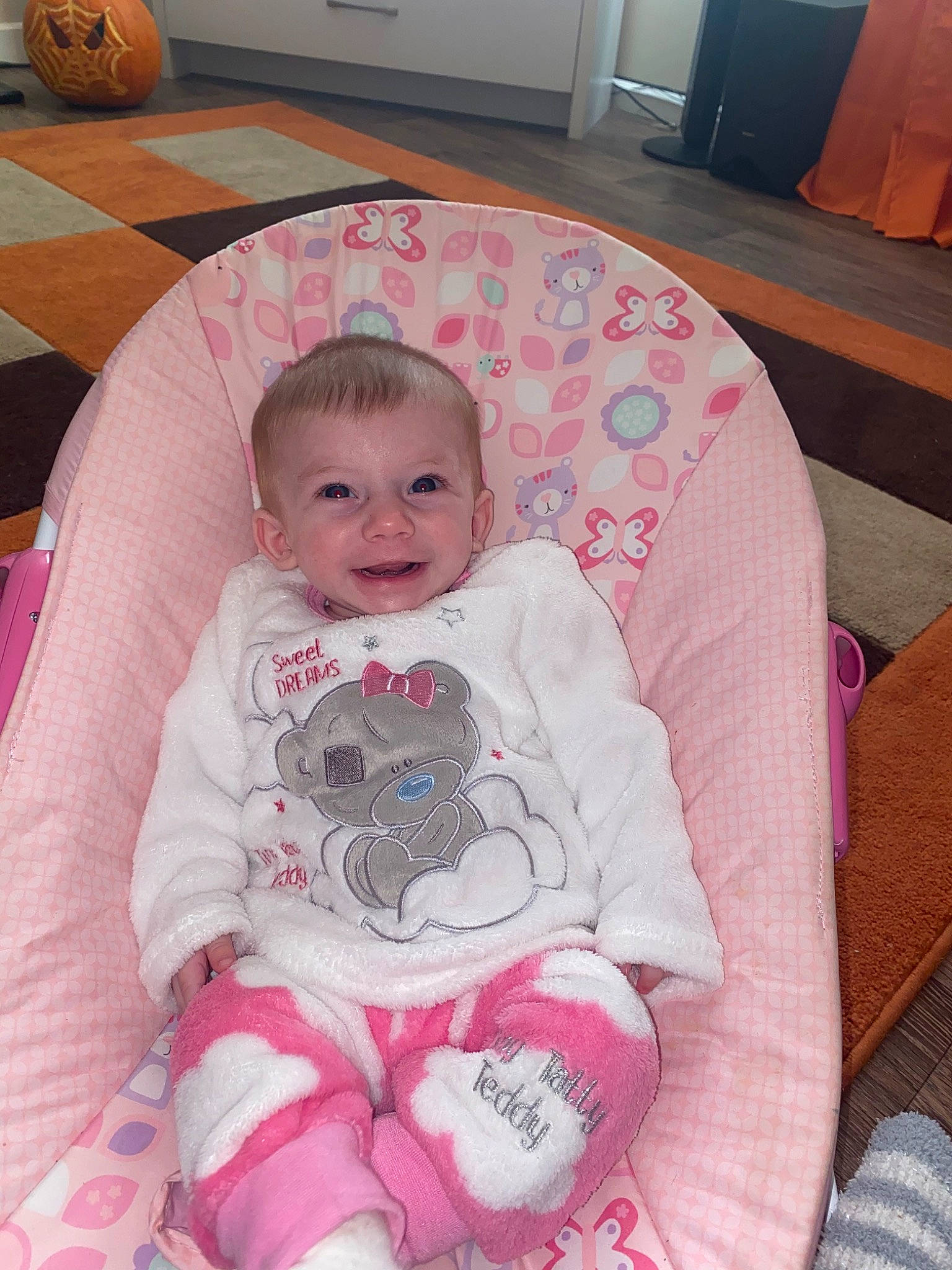 Evie Mai is registered to the contest to win money with this photo: baby, cheek, child, eye, face, head, iris, people, person, pink, product, room, sitting, skin, smile, toddler