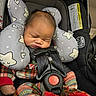 Austin Beirge is registered to the contest to win money with this photo: baby, infant, car_seat, sleeping, pajamas, plaid, headrest, star_pattern, safety_harness, red_socks, child, cute, indoors, seatbelt, newborn, person, resting, cozy, small_hands, soft
