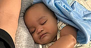 Austin Beirge is registered to the contest to win money with this photo: baby, sleeping, blanket, bottle, bed, hand, arm, infant, cozy, rest, child, soft, comfort, toy, nursery, clothing, peaceful, indoor, person, cute