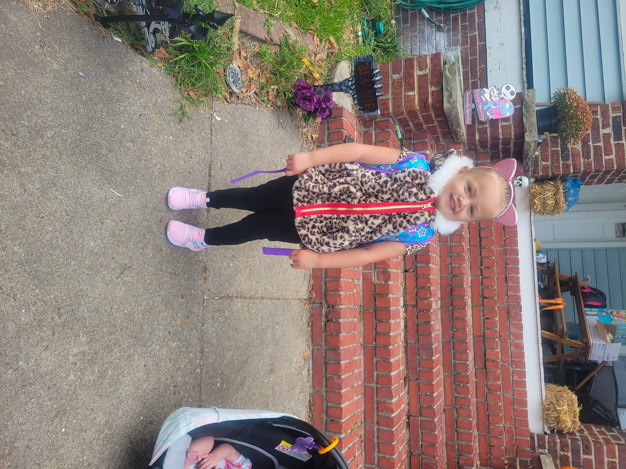 Athena is registered to the contest to win money with this photo: building, event, fun, human_leg, joy, leisure, pattern, person, plant, road_surface, sandal, street_fashion, tartan, textile, thigh, vacation