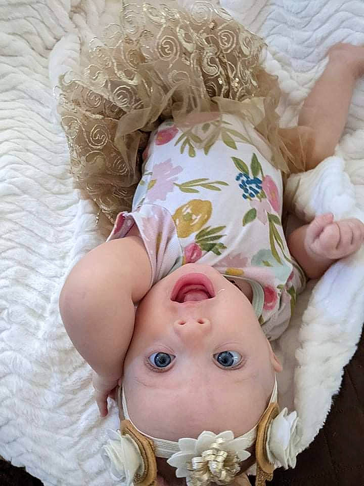 Valerie joined the competition — help win amazing prizes! baby, baby_toddler_clothing, cheek, child, comfort, dress, eye, eyelash, grass, happy, headgear, headwear, iris, lip, nose, person, pink, skin, sleeve, surprise