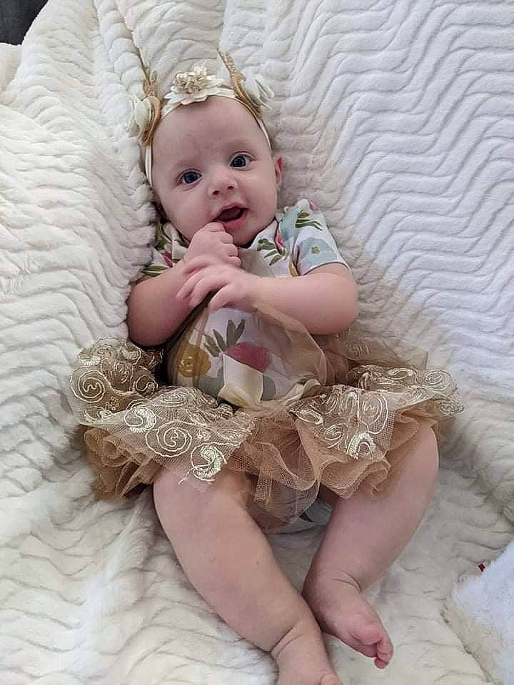 Valerie joined the competition — help win amazing prizes! baby, baby_toddler_clothing, blond, comfort, embellishment, eye, face, flash_photography, happy, headgear, iris, pattern, person, pink, sitting, skin, sleeve, smile, textile, thigh