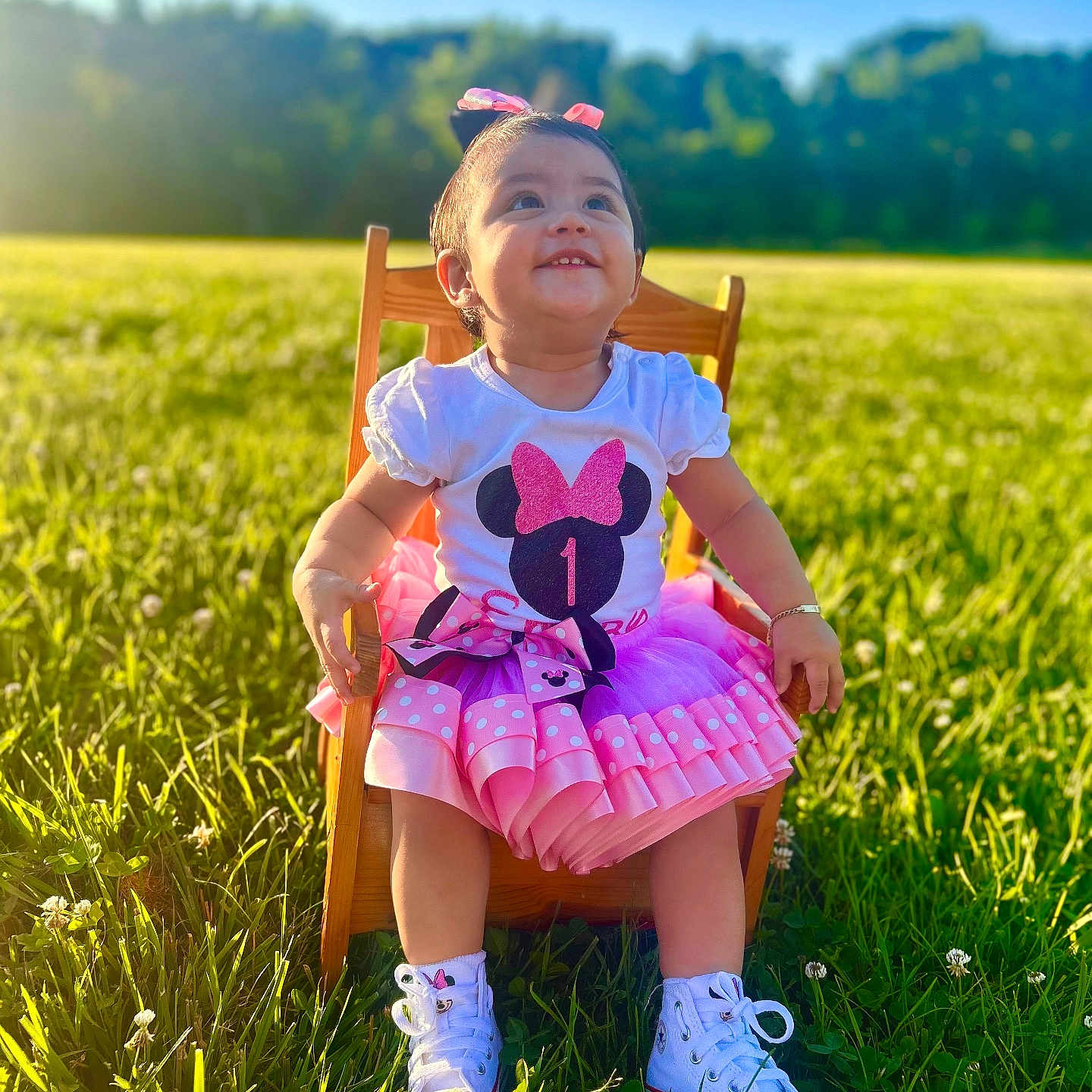 Emery joined the competition — help win amazing prizes! blue_sky, bow, child, cute, daylight, dress, face, grass, green_field, happy, nature, outdoor, pink, portrait, sitting, smiling, sunlight, toddler, white_shoes, wooden_chair