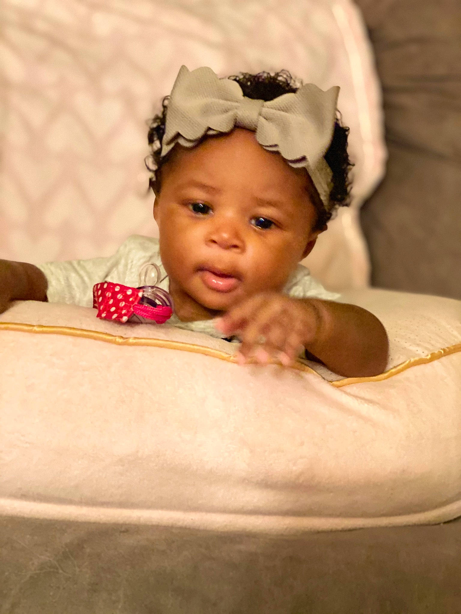 Cienna is registered to the contest to win money with this photo: baby, baby_products, baby_toddler_clothing, bonnet, cheek, child, costume, costume_accessory, ear, embellishment, eye, hair_accessory, headband, headgear, headpiece, mouth, nose, person, pink, skin