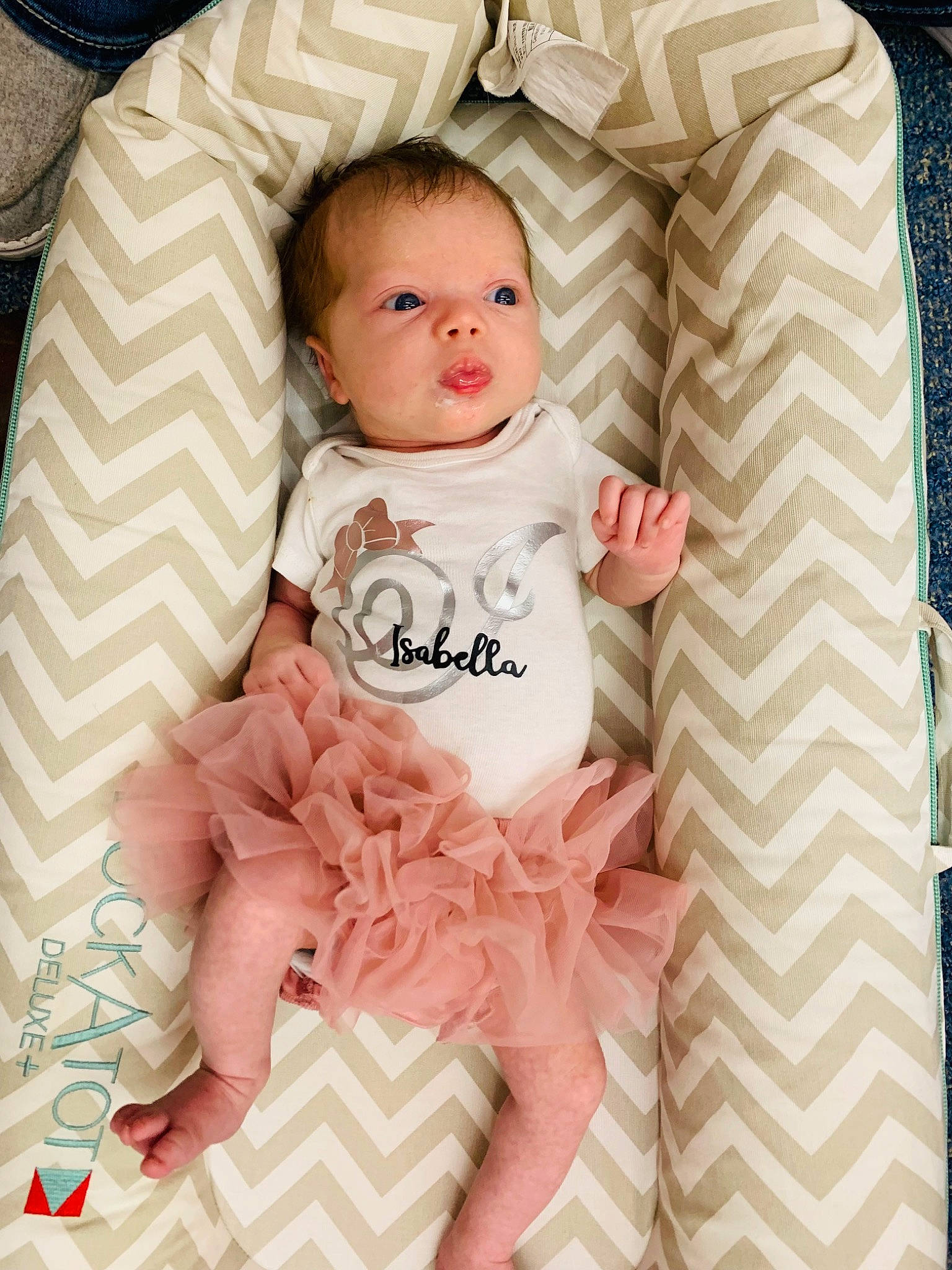 Isabella is registered to the contest to win money with this photo: baby, baby_products, baby_safety, baby_toddler_clothing, bedding, cheek, child, comfort, linens, mechanical_fan, pattern, peach, person, pink, product, room, sitting, sleeve, smile, t_shirt