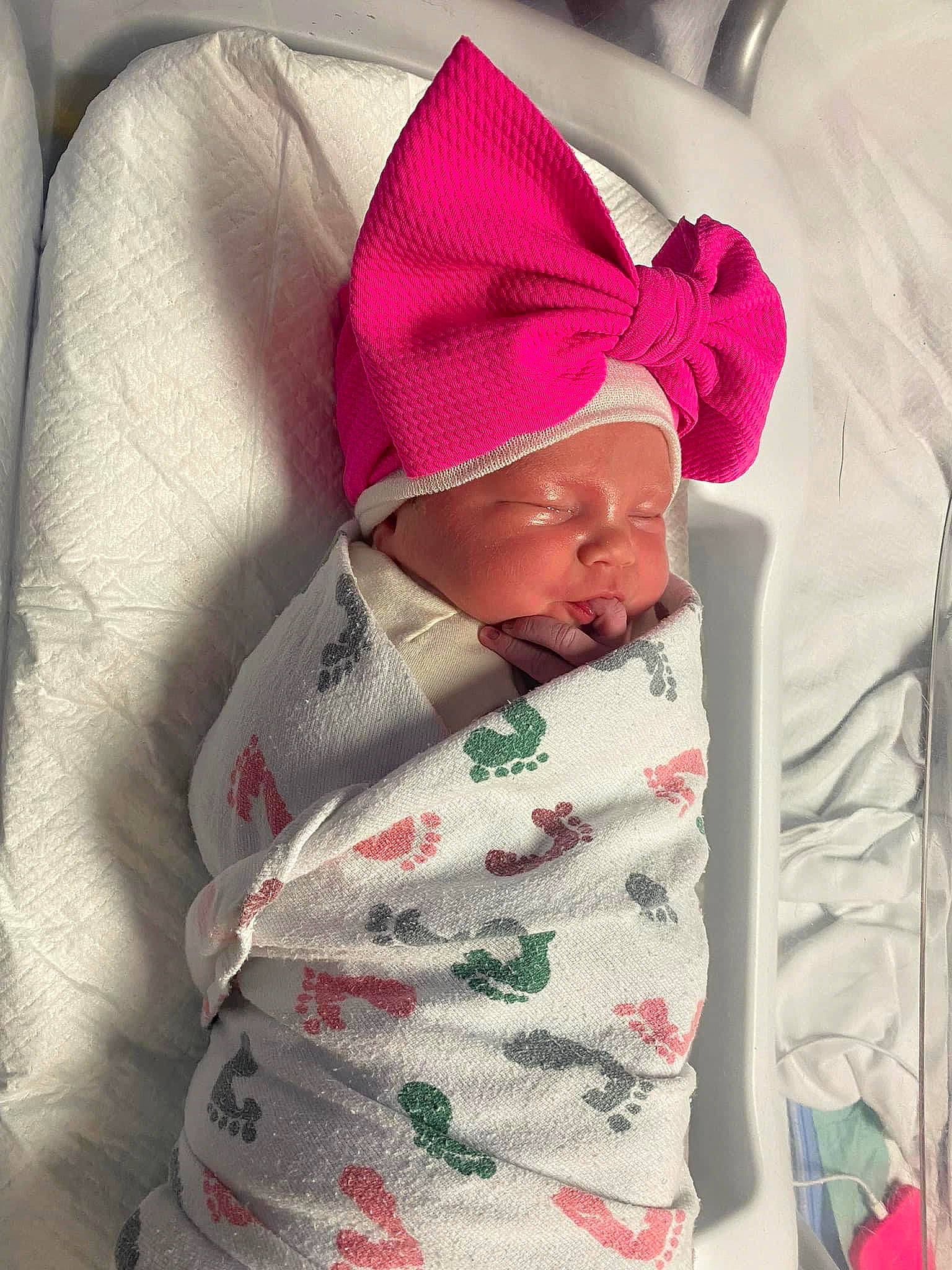 Sophia is registered to the contest to win money with this photo: baby, baby_products, baby_sleeping, baby_toddler_clothing, beanie, bedding, blanket, carmine, child, comfort, face, flesh, head, headwear, linens, magenta, pattern, person, room, sleeve