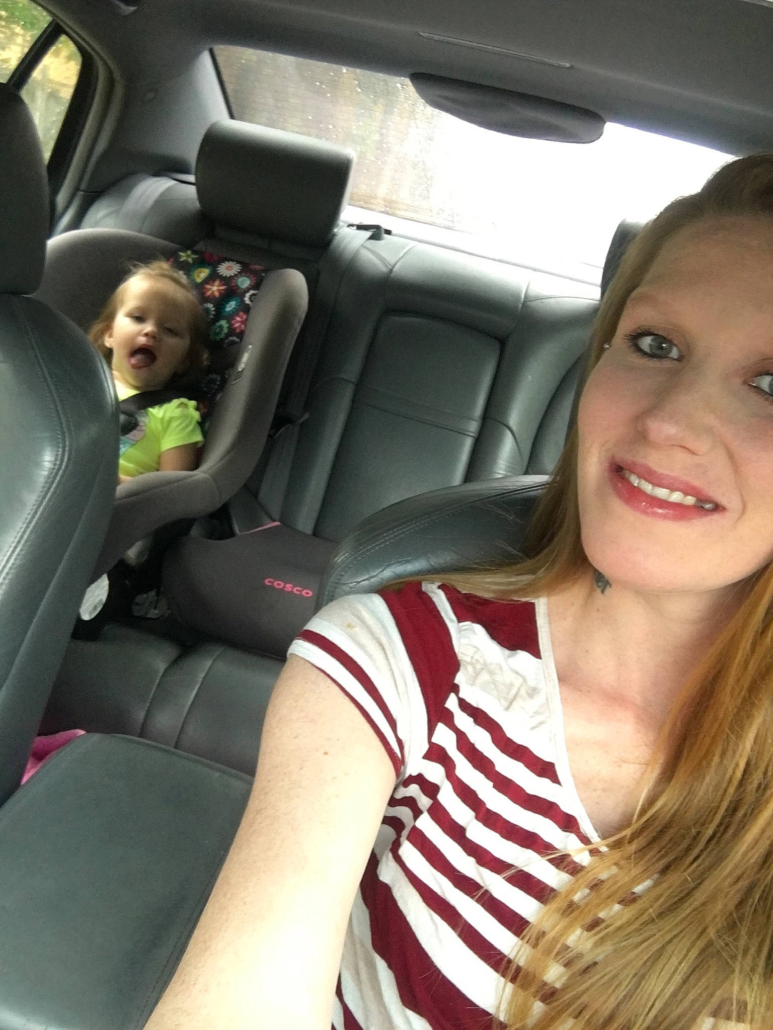 Natalya is registered to the contest to win money with this photo: auto_part, car, car_seat, car_seat_cover, driving, family_car, head_restraint, joy, person, seat_belt, vehicle