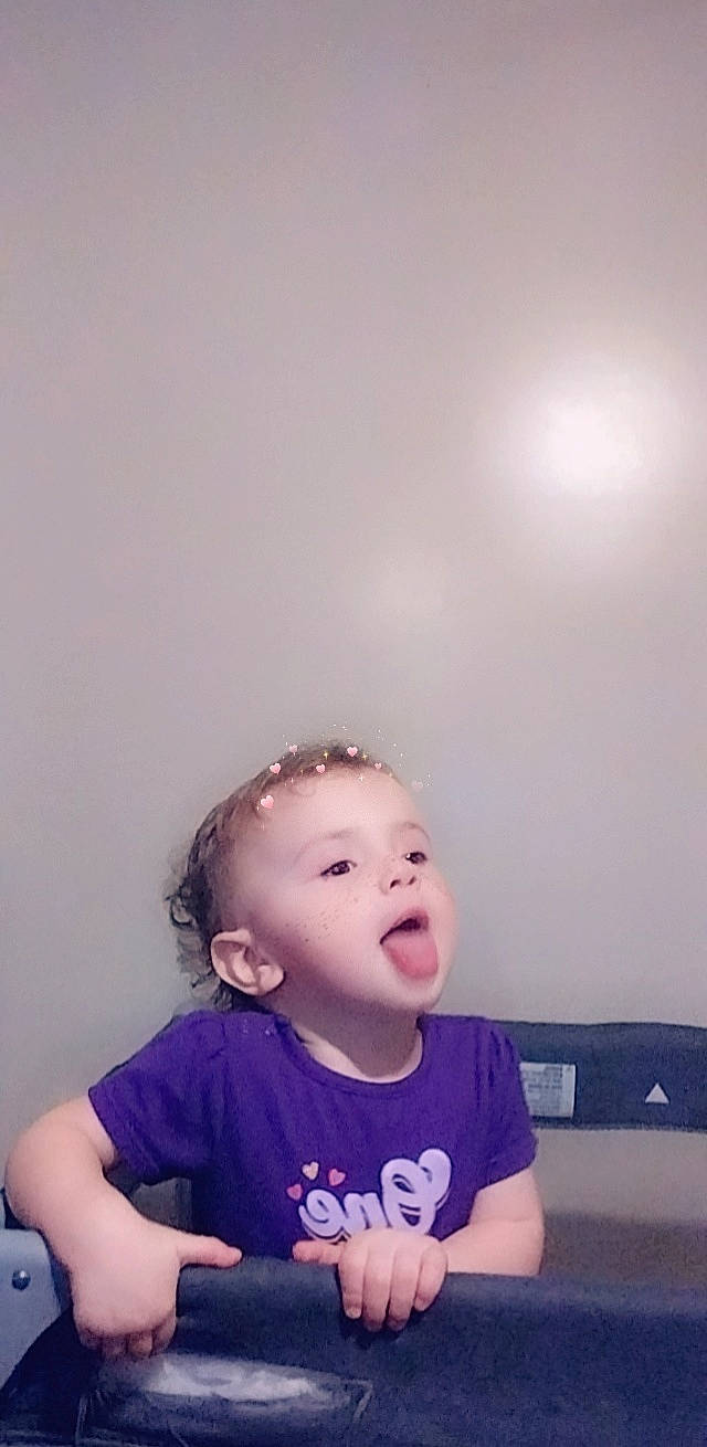 Sarah joined the competition — help win amazing prizes! arm, baby, baby_toddler_clothing, cheek, child, ear, electric_blue, eyelash, fashion_accessory, flash_photography, fun, gesture, hair_accessory, happy, head, jaw, person, sleeve, smile, t_shirt