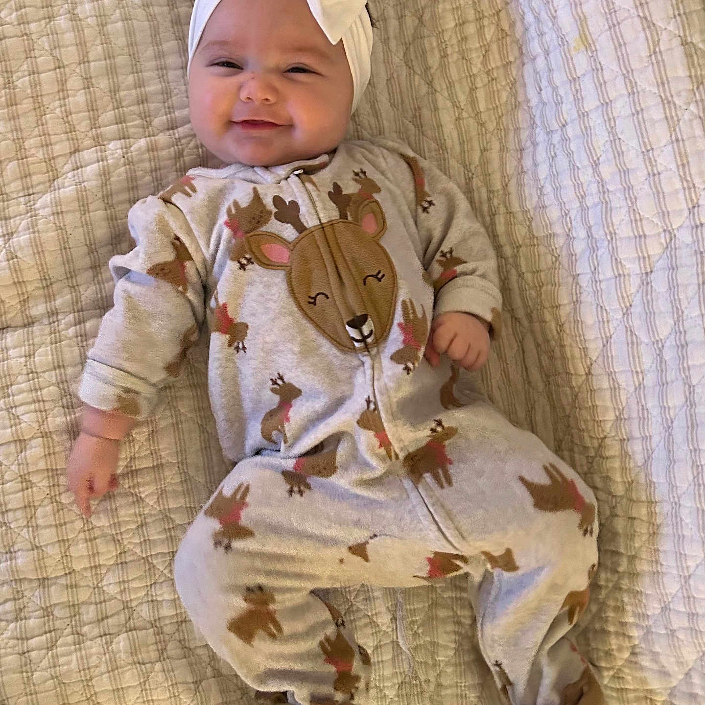 Madalynn joined the competition — help win amazing prizes! baby, babylaughing, bed, bonnet, cap, clothing, couch, face, furniture, happy, hat, head, newborn, pajamas, pants, person, photography, portrait, quilt, sitting