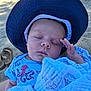 Colton is registered to the contest to win money with this photo: baby, sleeping, hat, blue_shirt, octopus_print, blanket, beach, sand, flip_flops, child, peaceful, outdoor, sun_hat, infant, close_up, portrait, resting, summer, vacation, cute