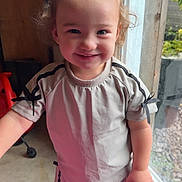 Skai joined the competition — help win amazing prizes! toddler, child, smiling, standing, barefoot, pony_tail, short_sleeves, light_clothing, ribbons, indoor, window, glass_door, concrete_floor, happy, cute, person, young_child, casual, natural_light, home