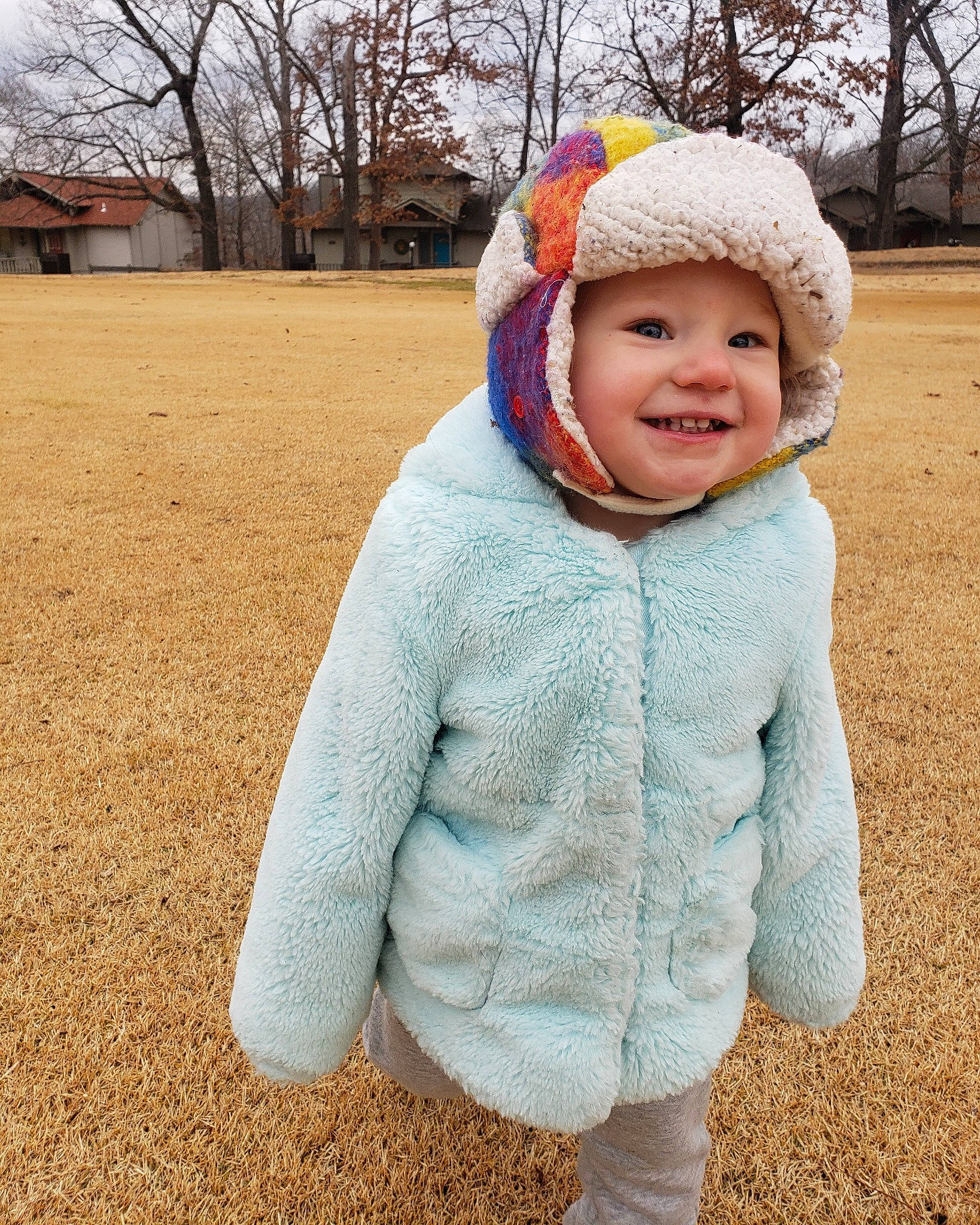 Arizona joined the competition — help win amazing prizes! baby_toddler_clothing, cap, child, face, freezing, grass, happy, headwear, hood, jacket, joy, knit_cap, people_in_nature, person, sky, sleeve, smile, standing, toddler, tree