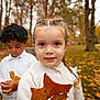 child, girl, boy, leaf, autumn, park, trees, braid, sweater, portrait, outdoors, smile, fall_leaves, candid, brown_eyes, playground, white_shirt, shallow_depth_of_field, friends, season_fall