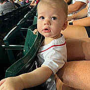 Brady joined the competition — help win amazing prizes! toddler, child, stadium, seating, sports_jersey, crowd, person, curious, mohawk, reaching_hand, spectator, event, casual_clothing, daylight, family, public_place, face, expression, indoor, people
