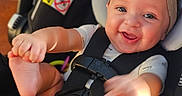 Maelynn joined the competition — help win amazing prizes! adorable, baby, bright_eyes, car_seat, child, close_up, cute, flower, foot, hand, happy, headband, indoors, infant, person, playful, seatbelt, sitting, skin, smiling