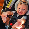Maelynn joined the competition — help win amazing prizes! baby, smiling, headband, flower, car_seat, infant, happy, child, cute, playful, seatbelt, close_up, person, skin, indoors, sitting, foot, hand, bright_eyes, adorable
