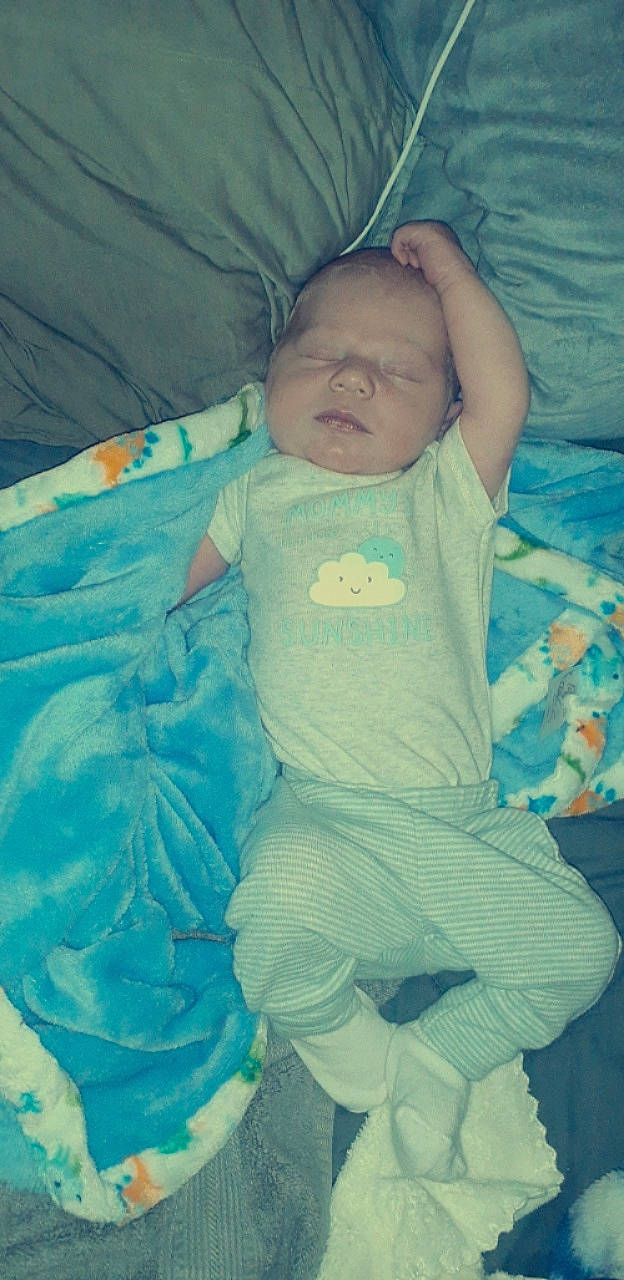 Ronin is registered to the contest to win money with this photo: aqua, azure, baby, baby_products, baby_toddler_clothing, beauty, cheek, child, comfort, electric_blue, eye, happy, linens, person, product, sitting, textile, tints_and_shades, toddler