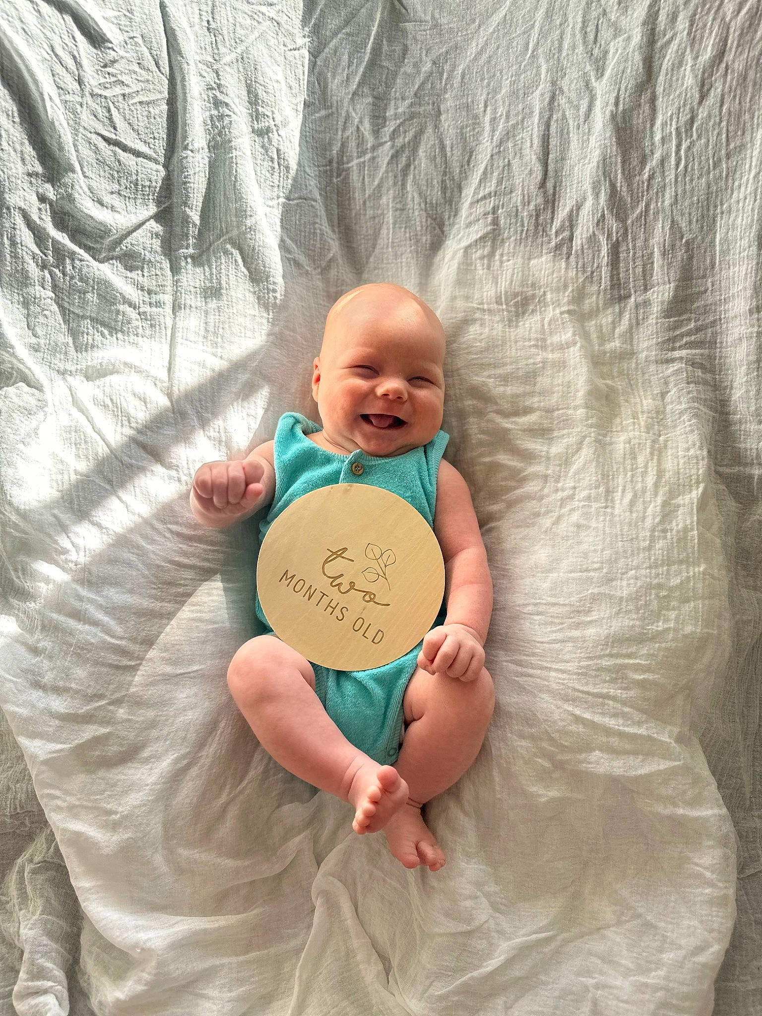 Henry joined the competition — help win amazing prizes! baby, bedding, child, comfort, eye, facial_expression, finger, fun, gesture, hand, happy, joy, linens, nail, person, skin, smile, t_shirt, textile, thumb