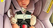 Ahzara Ourlanii joined the competition — help win amazing prizes! baby, sleeping, car_seat, pink_bow, lavender, child, infant, hello_kitty, cute, safety_harness, newborn, peaceful, soft, clothing, headband, footwear, indoors, seatbelt, resting, toddler