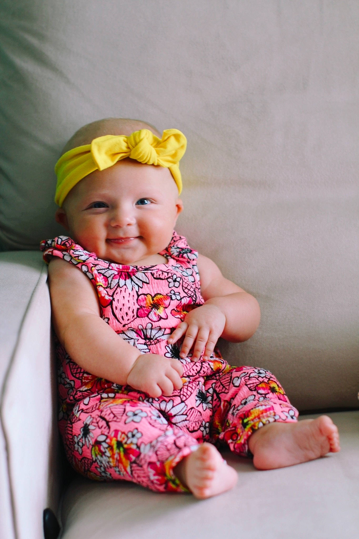 Kaiya is registered to the contest to win money with this photo: baby, baby_toddler_clothing, cap, cheek, child, child_model, dress, fashion_accessory, hair_accessory, hat, headgear, joy, pattern, person, photography, pink, sitting, skin, smile, toddler