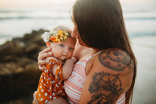 Kaiya is registered to the contest to win money with this photo: abdomen, baby, beach, child, daughter, hand, happy, headwear, joint, love, mother, person, photograph, photography, sea, skin, summer, tattoo, temporary_tattoo, toddler